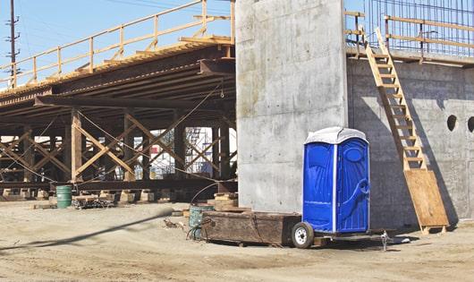 ensuring proper sanitation at the construction site with these porta potties